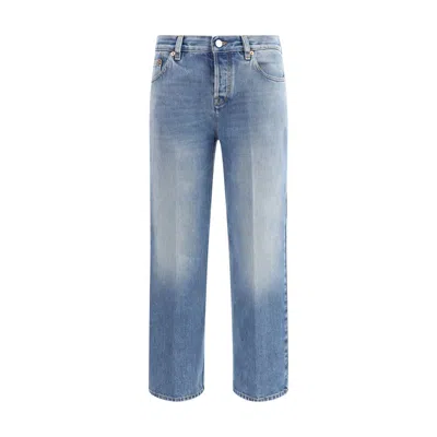 Gucci Blue Jeans With Logo Patch On The Rear And Faded Effect In Denim Woman