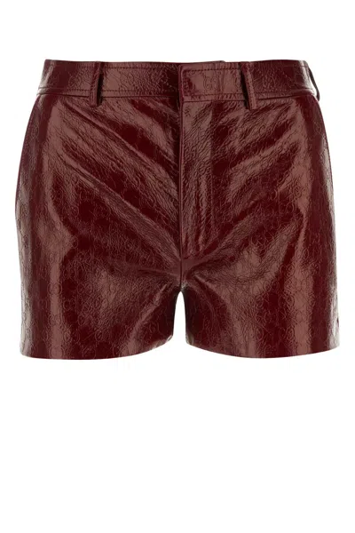 Gucci Gg Embossed Shiny Leather Shorts In Red