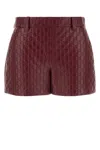 Gucci Gg Embossed Leather Shorts In Rossoancora