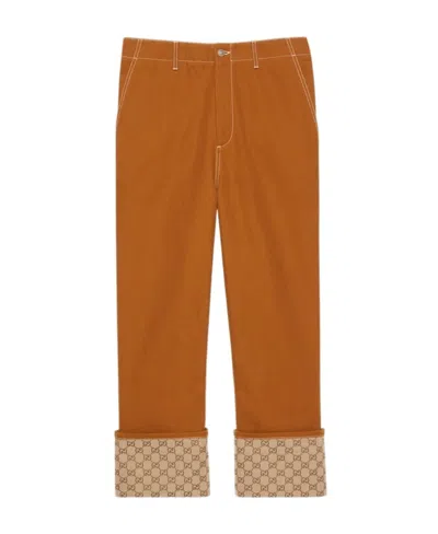 Gucci Turn-up Leather Cuff Trousers In Brown