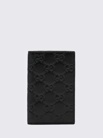 Gucci Gg Embossed Long Card Holder In Black