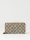 Gucci Women Gg Emblem Zipped Wallet In Brown