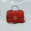 Gucci Gg Marmont Small Matelasse Leather Top Handle Satchel In Red