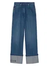 Gucci Wide-leg Denim Jeans With Leather Logo Tag And Roll-up Ankle Cuffs For Women In Denim