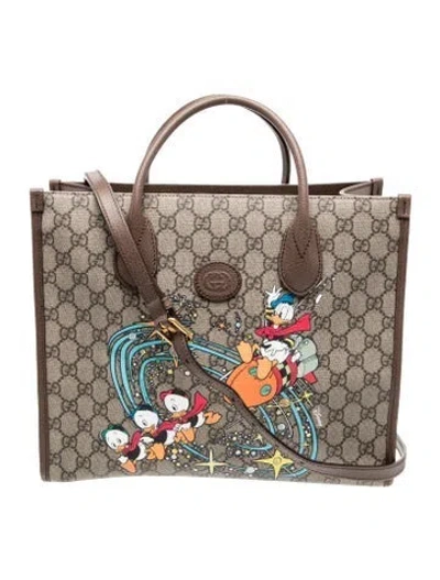 Pre-owned Gucci X Disney Gg Supreme Tote In Brown