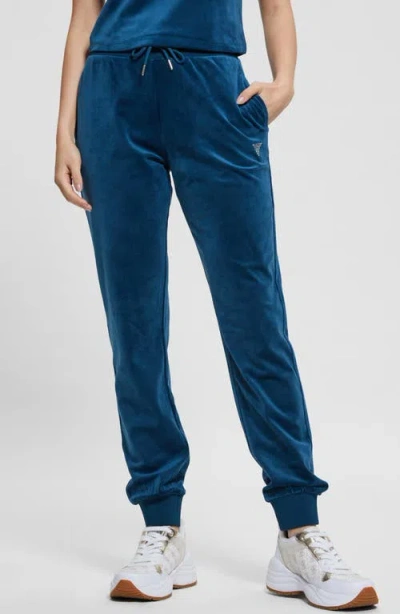 Guess Couture Crystal Logo Embellished Velour Joggers In Deep Opal