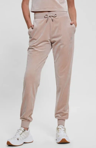 Guess Couture Crystal Logo Embellished Velour Joggers In Skin Shadow