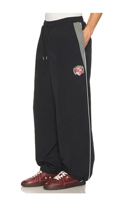 Guess Jeans Embroidered Nylon Track Pant In Black