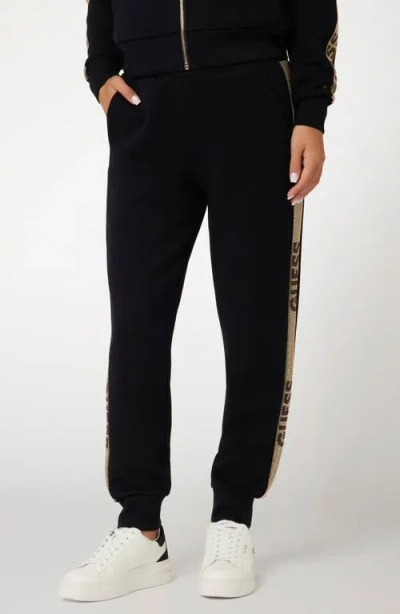 Guess Studs Logo Sweatpants In Jet Black