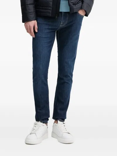 Guess Usa Chris Triangle-logo Jeans In Blue
