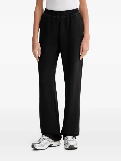 Guess Usa Habi Logo-embroidered Track Pants In Black