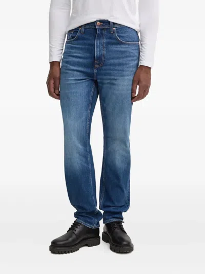 Guess Usa Logo-patch Jeans In Blue