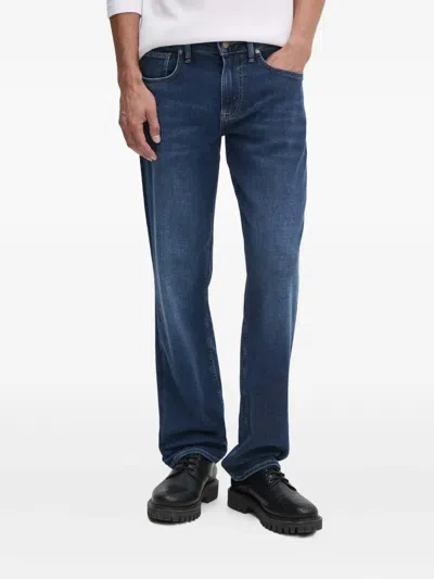Guess Usa Logo-patch Jeans In Blue