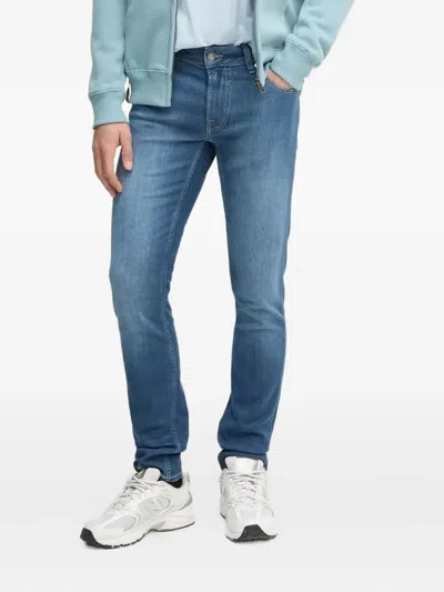 Guess Usa Logo-patch Slim-fit Jeans In Blue