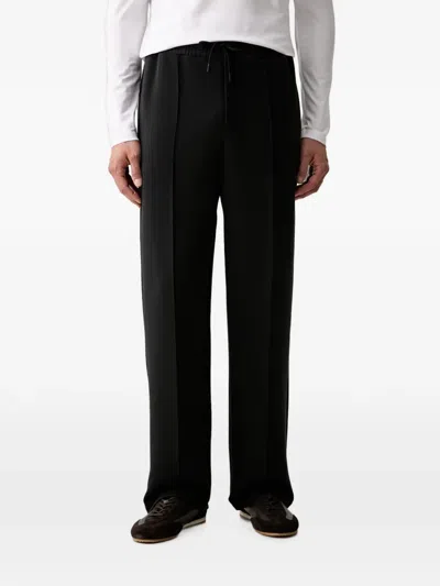 Guess Usa Logo-patch Drawstring Track Pants In Black