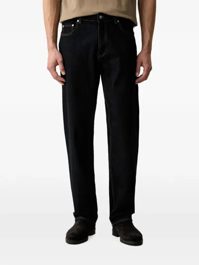 Guess Usa Logo-patch Pocket Jeans In Black