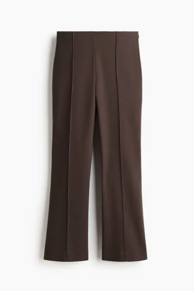 H&m Flared Crease-front Trousers In Brown