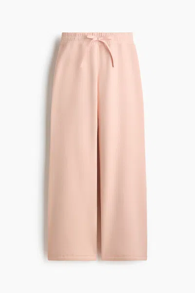 H&m Flared Sweatpants In Light Peach Pink
