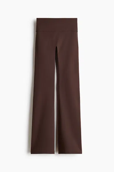 H&m Flared Yoga Leggings With Softmove In Brown