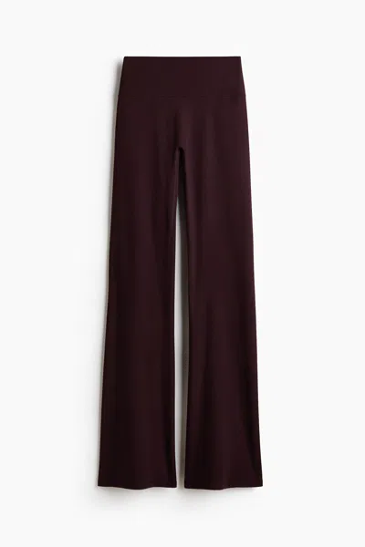 H&m Flared Yoga Leggings With Softmove In Brown