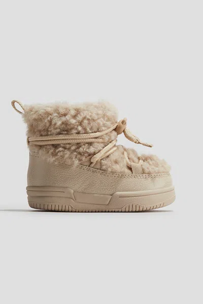 H&m Fluffy Boots In Gold