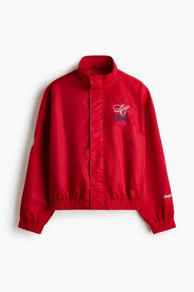 H&m Loose Fit Embroidered-motif Nylon Track Jacket In Red