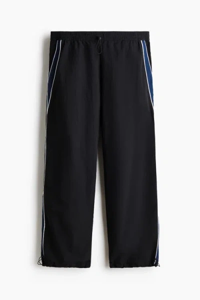 H&m Loose Fit Nylon Track Pants In Black