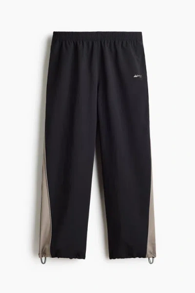 H&m Loose Fit Nylon Track Pants In Black
