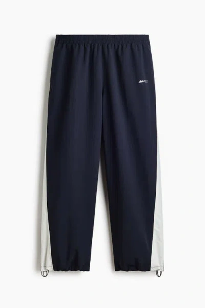 H&m Loose Fit Nylon Track Pants In Blue