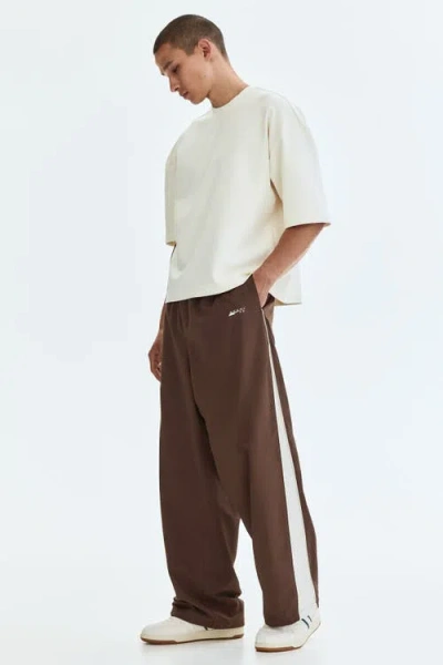 H&m Loose Fit Nylon Track Pants In Brown