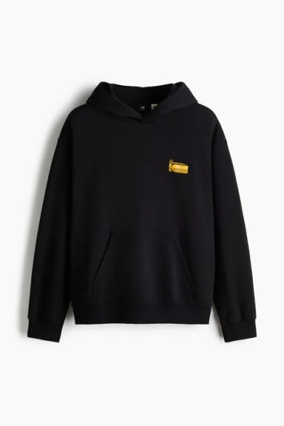 H&m Loose Fit Printed Hoodie In Black