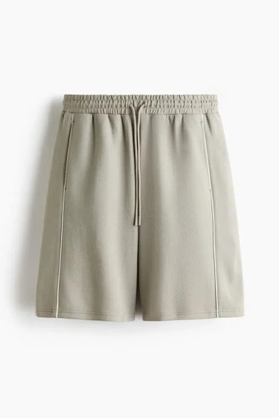 H&m Loose Fit Sports Shorts With Drymove In Gold