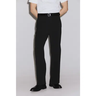H&m Loose-fit Four-way Stretch Chinos In Black