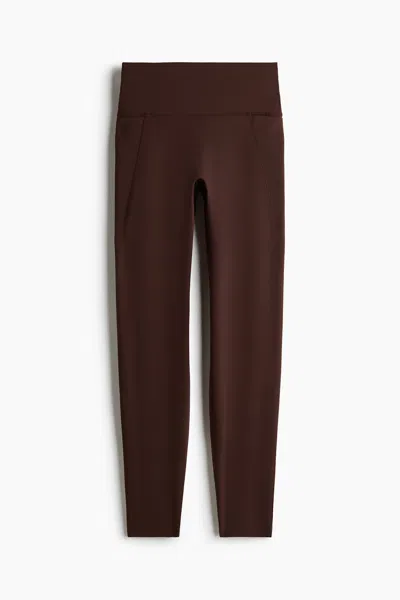 H&m Pocket-detail Sports Leggings With Softmove In Brown