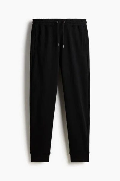 H&m Regular Fit Tapered Sweatpants In Black