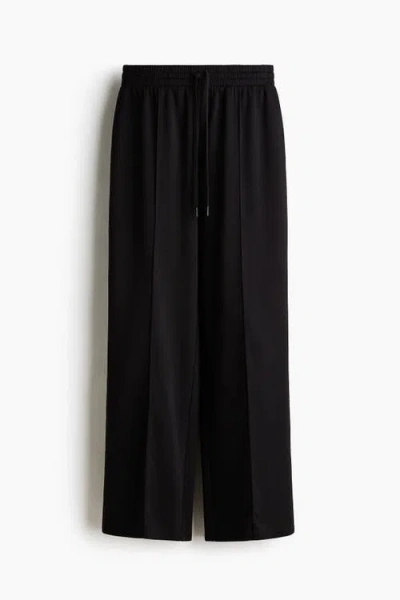 H&m Wide Crease-front Joggers In Black
