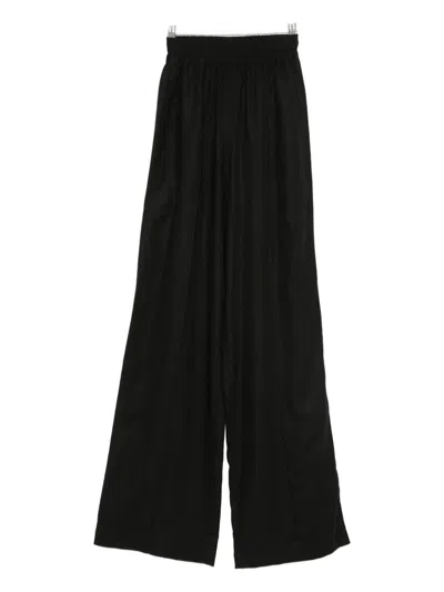 Hamza Skipper Linen Flared Trousers In Black