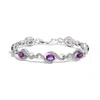 Haus Of Brilliance .925 Sterling Silver 1/10 Cttw Natural Round Diamond And 7x5mm Oval Amethyst Cross Tennis Bracelet In White