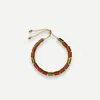 Her New Tribe Toffee And Karat Candy In Green
