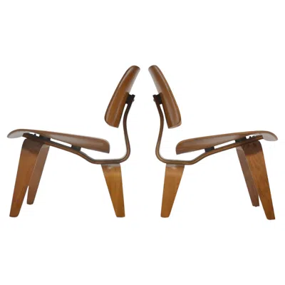 Pre-owned Herman Miller Eames Rare Matched Pair Of Walnut Lcw Lounge Chairs In Brown