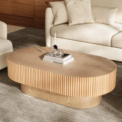 Hermes 43.7'' W Solid Wood Oval Coffee Table With Fluted Design In Tan