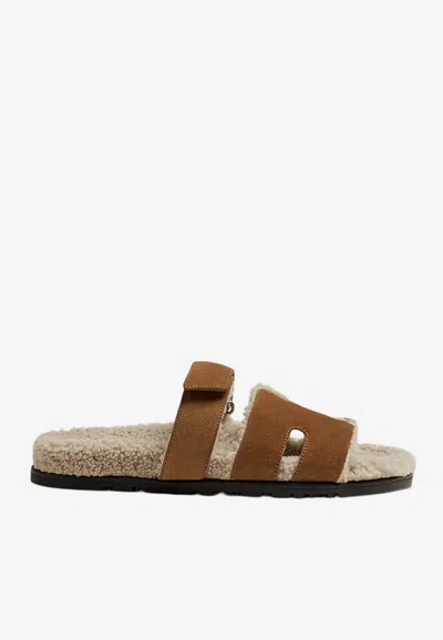 Hermes Chypre Sandals In Brun Fumé Suede And Ecru Shearling In Brown