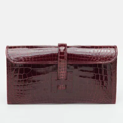 Pre-owned Hermes Elan Jige 29 Bourgogne Shiny Niloticus Crocodile Clutch In Burgundy
