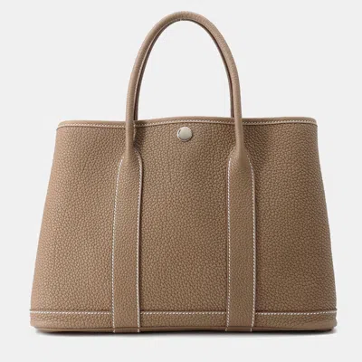 Pre-owned Hermes Garden Party Etoupe Negonda Leather Tpm In Brown