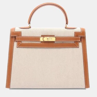 Pre-owned Hermes Kelly 32 Gold Toile H And Leather Handbag In Sand