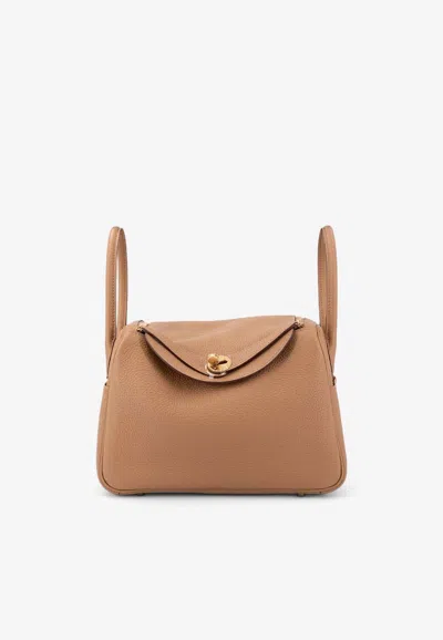 Hermes Lindy 26 In Biscuit Clemence With Gold Hardware In Brown