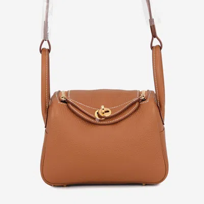 Pre-owned Hermes Lindy Gold Taurillon Clemence Size Mini In Brown