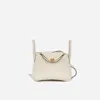 Hermes Mini Lindy 20 Ii In Nata Taurillon Clemence With Gold Hardware In Brown