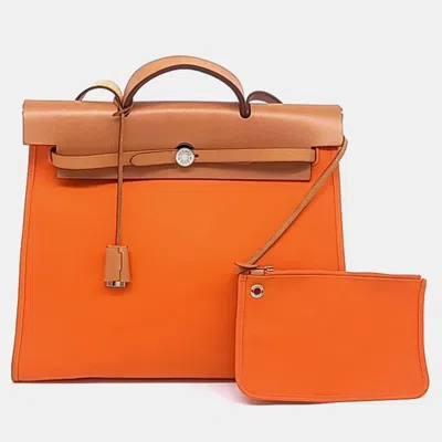 Pre-owned Hermes Orange Toile And Leather New Zip Herbag Large (n)