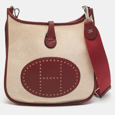 Pre-owned Hermes Rouge H/beige Taurillon Clemence Leather And Canvas Evelyne Iii Pm Bag In Red
